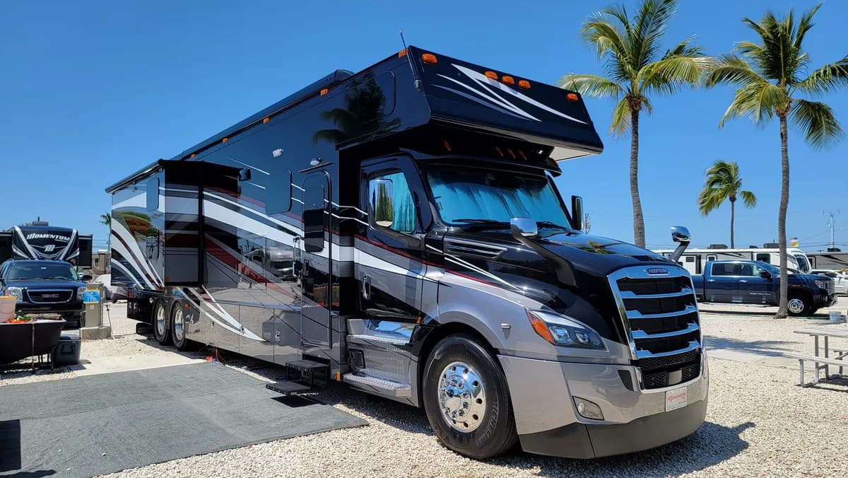 Super C motorhome gleaming after a Leoserve wash and wax, palm trees behind