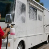 Leoserve technician foam-washing a motorhome in the Florida Keys